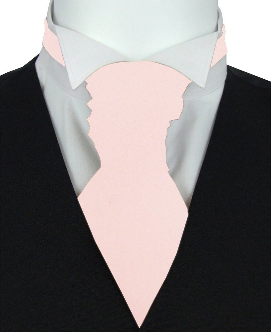 Baby Blush Wedding Cravat styled on a white shirt and black waistcoat, ideal for grooms seeking a soft pastel accent for formal attire.