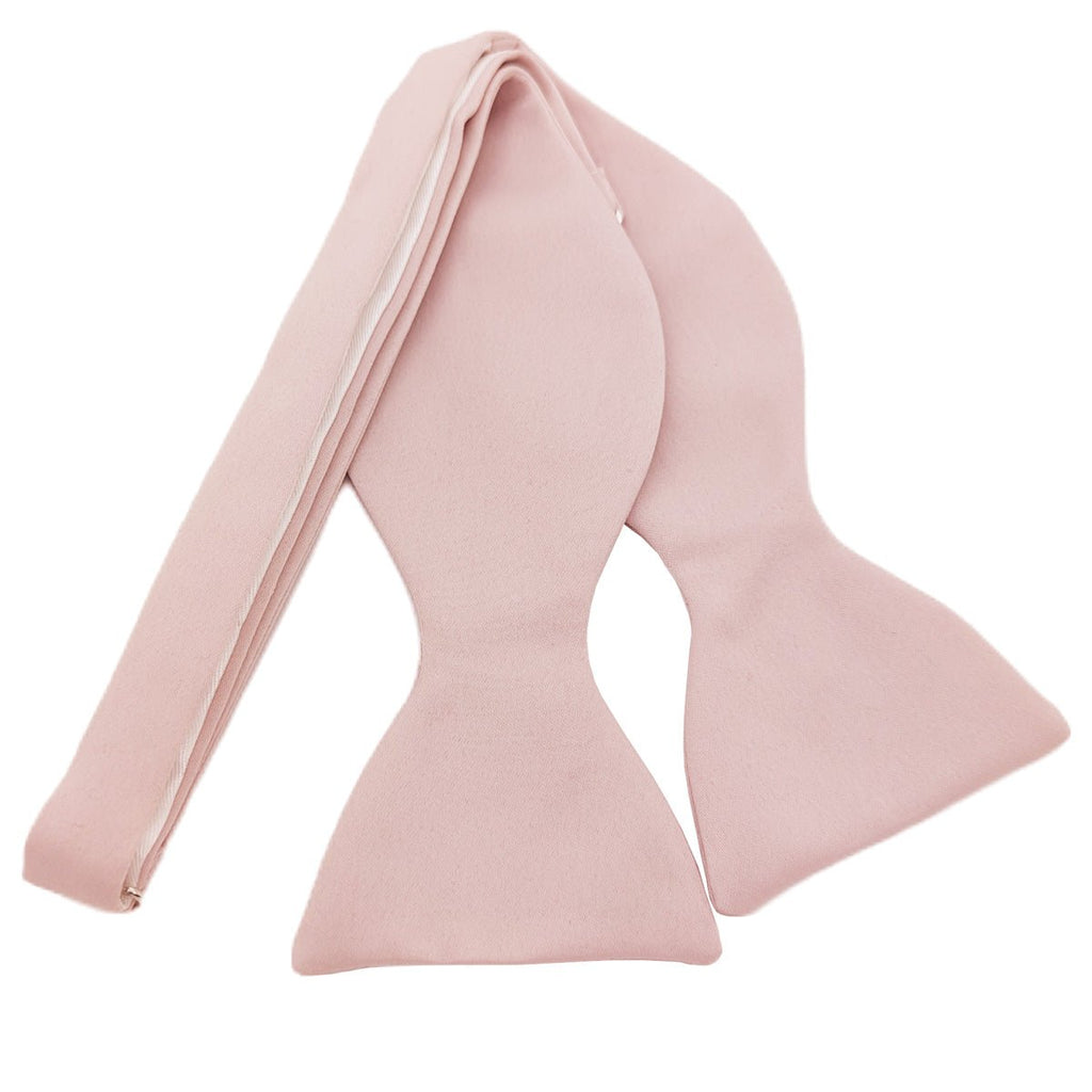 Self-tie Blush Pink Bow Tie laid flat, handmade in the UK, perfect for weddings and formal occasions.