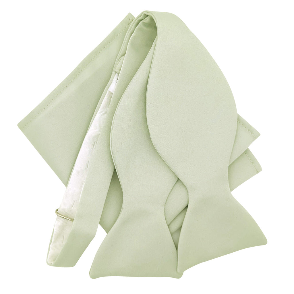Untied Willow Bow Tie with matching pocket square in sage green, ideal for weddings. Handmade and adjustable for groomsmen.