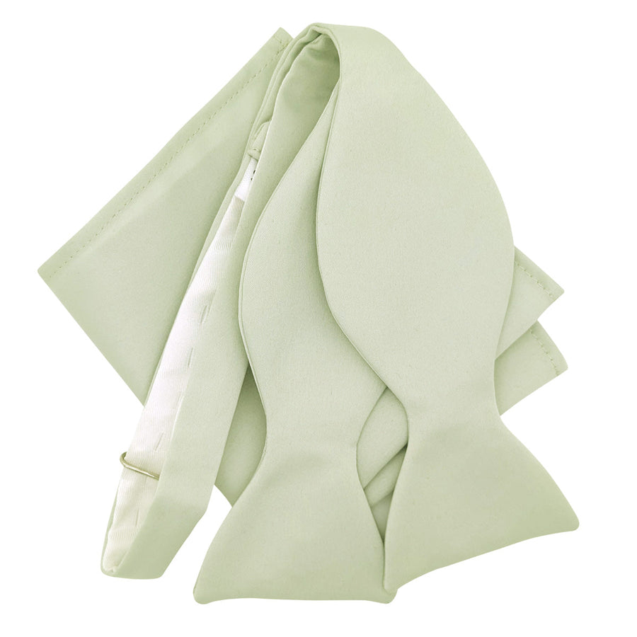 Untied Willow Bow Tie with matching pocket square in sage green, ideal for weddings. Handmade and adjustable for groomsmen.