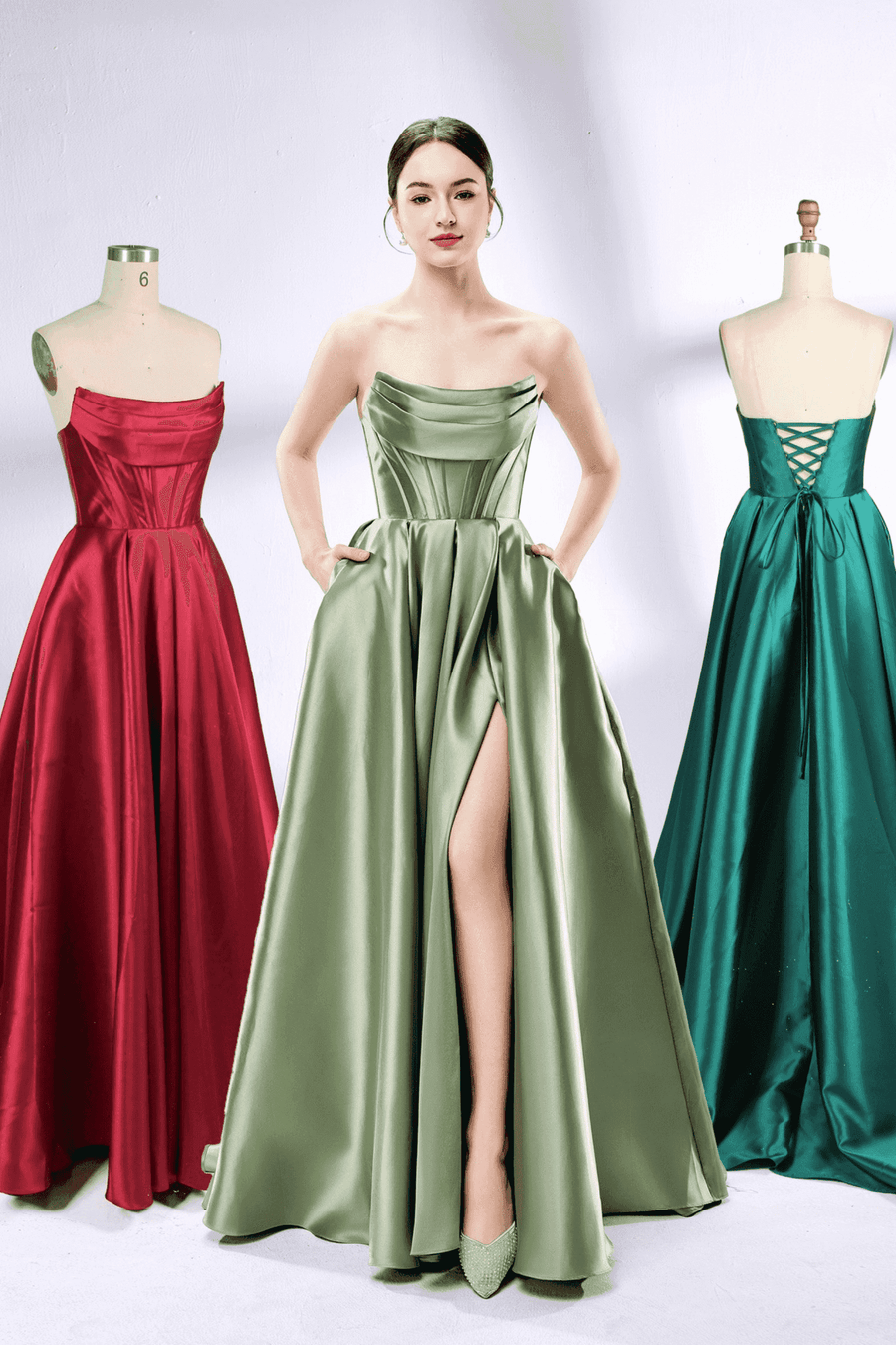 Carmen Ball Gown - Light Blue Satin with strapless pleated bodice, thigh-high slit, and pockets, displayed in green, red, and teal variations.
