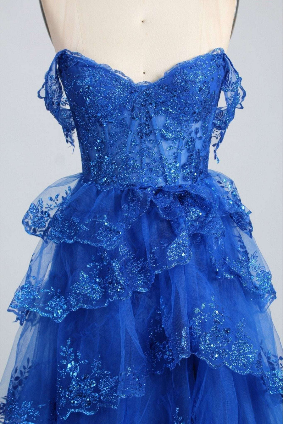 Close-up of Chloe Blue Glitter Off-the-Shoulder Prom Dress showing detailed sequin lace bodice and tiered glitter tulle skirt for formal events.