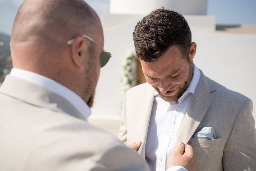 Groom wearing Dusty Blue Pocket Square - Wedding Accessory | Handmade, 25cm in beige suit, styled for a beach wedding look.