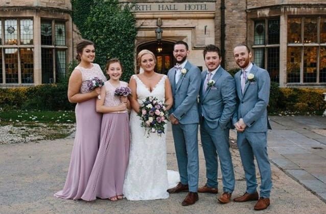 Wedding party in coordinated attire featuring Lavender Frost Bow Ties and lavender dresses. Perfect color match for elegant wedding themes.