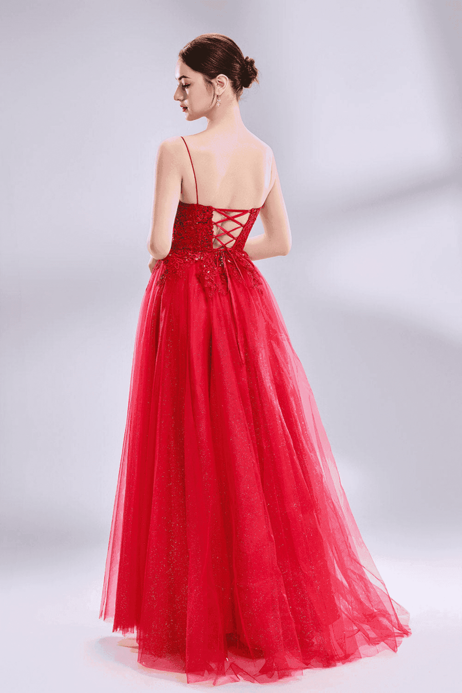 Back view of Jessica Stuart Nina Beaded Ball Gown featuring lace-up corset and glitter tulle skirt. Ideal for prom or formal gala events.