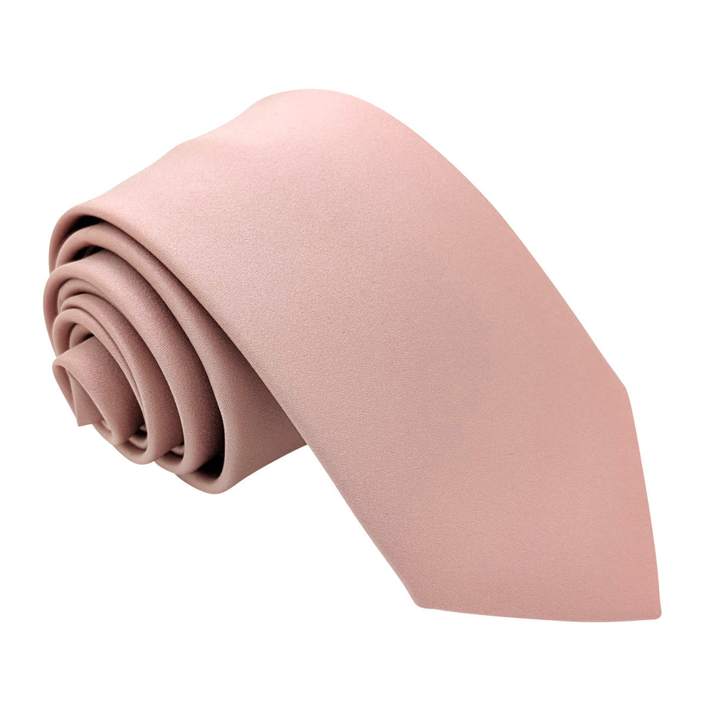 Suede Pink Wedding Tie rolled neatly, showcasing its soft texture and elegant blush tone. Ideal for groomsmen attire in wedding events.