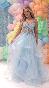 Blue glittery ball gown with lace bodice and voluminous tulle skirt at a colorful event