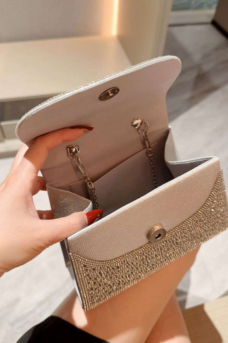 Silver Crystal studded clutch Bag with Rope Handle featuring a magnetic snap closure and interior chain strap, perfect for evening events.