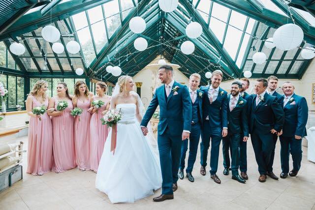 Groomsmen wearing Rose Gold Pocket Square - Wedding Accessory | Handmade, Durable. Coordinated with bridesmaids' dresses for a stylish wedding look.