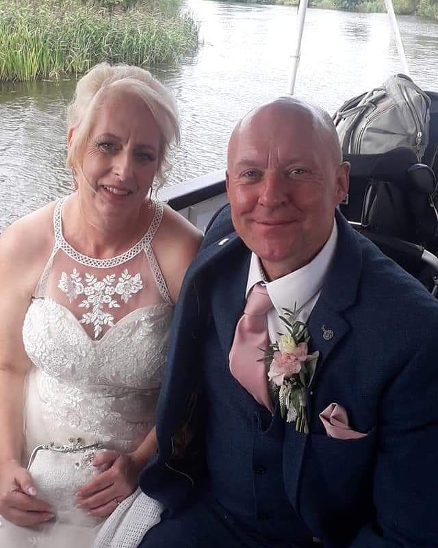 Groom wearing Rose Gold Pocket Square - Wedding Accessory | Handmade, Durable. Complements navy suit and blush boutonniere for a refined wedding style.