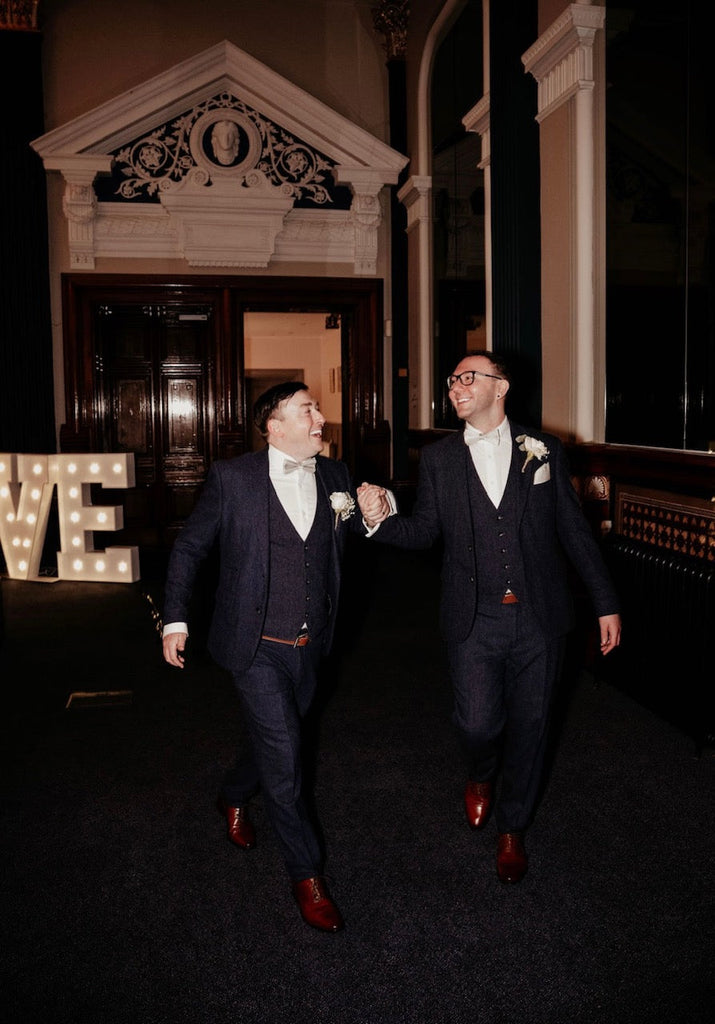 Grooms wearing the Silver Birch Bow Tie - Wedding Accessory | Handmade, Adjustable, paired with navy suits at a wedding celebration.