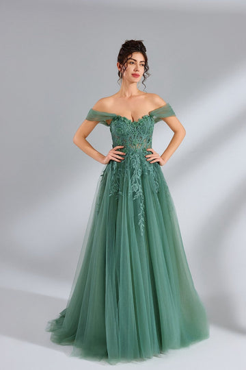 model in sage green dress net tulle and flowers