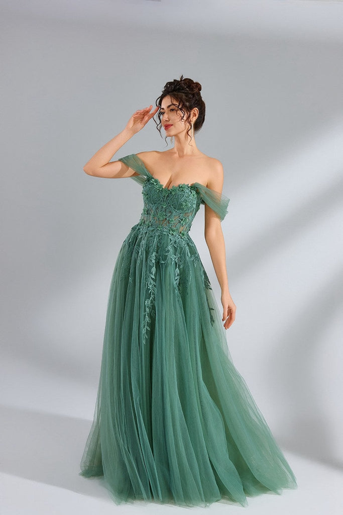 view of model in green off shoulder ballgown