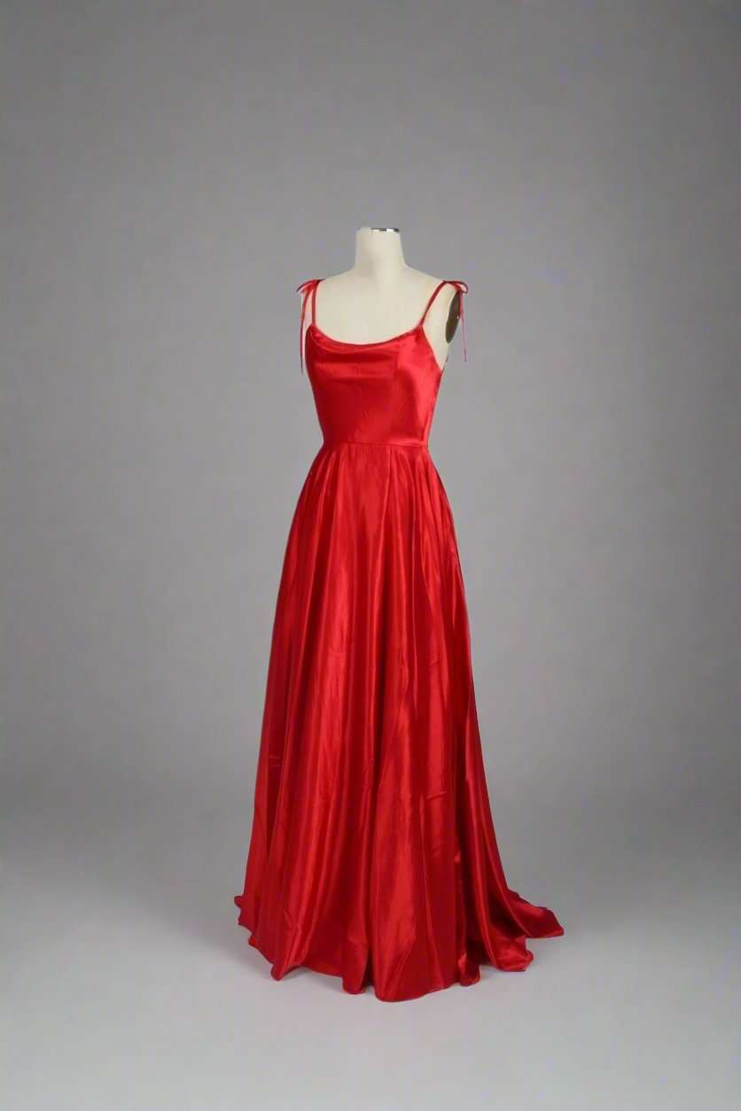Red dress on a mannequinFront view of Abby Red Satin Ballgown 32644, showcasing its elegant design with tie-up straps and a flowing skirt.