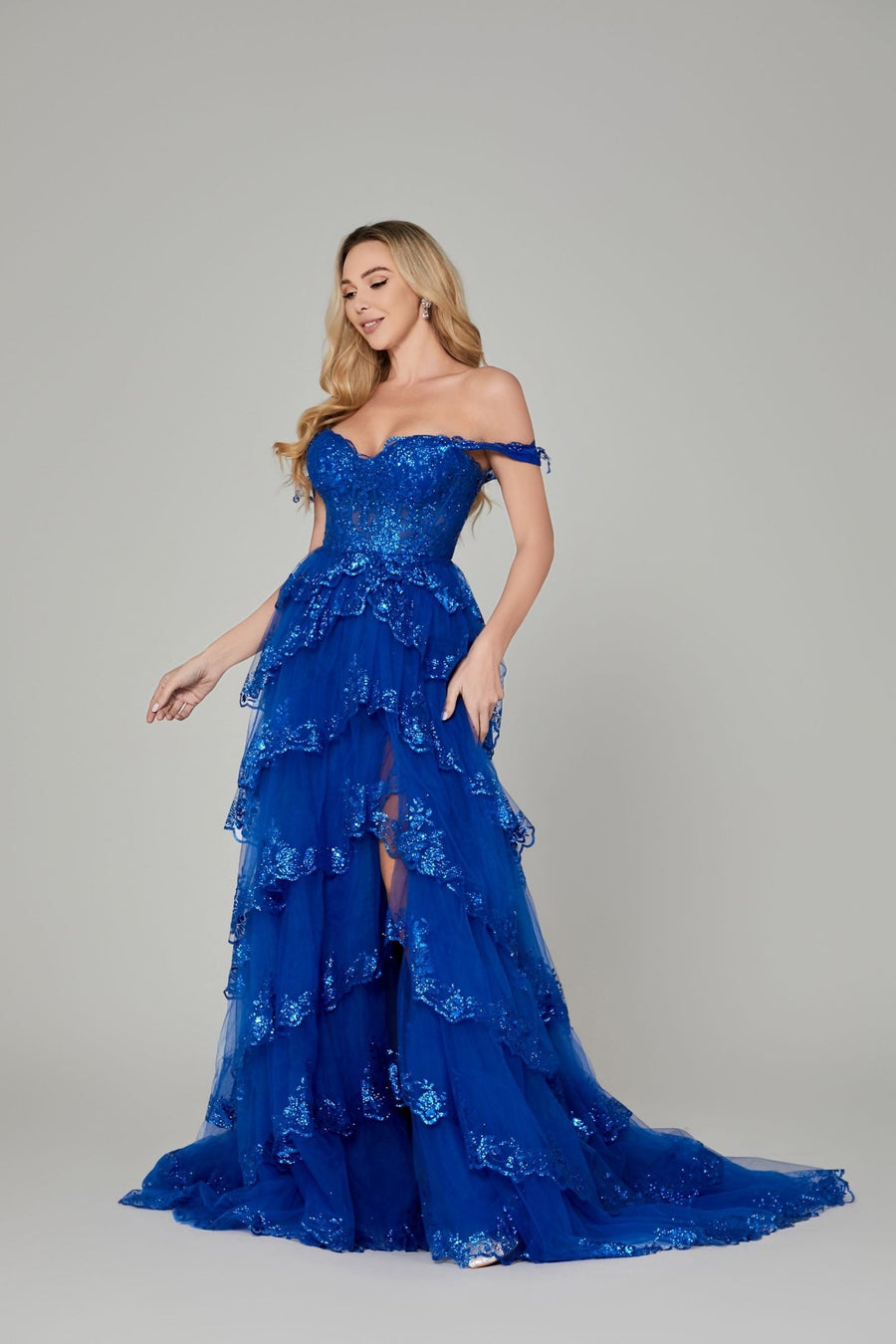 Chloe Lilac Glitter Dress - Off-Shoulder Prom style in royal blue with lace appliques and sequin embellishments. Features tiered glitter tulle and corset bodice.