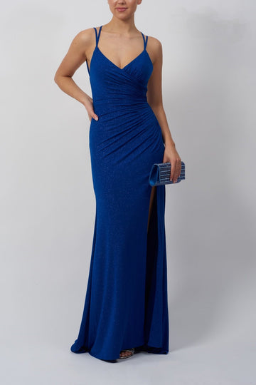model standing in a blue glitter dress