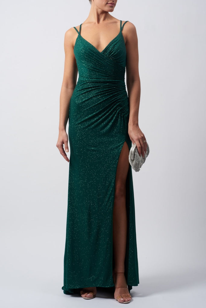 lady wearing a forest green evening dress in stretch glitter fabric with rouching