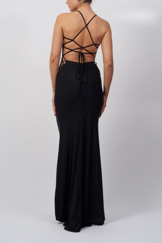 back view of a long black evening dress with laceup back and crisscross details on the side