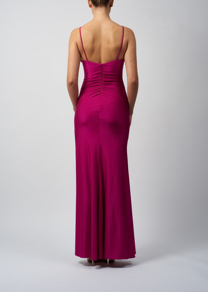 back view of lady wearing jersey evening dress with zip back in Magenta