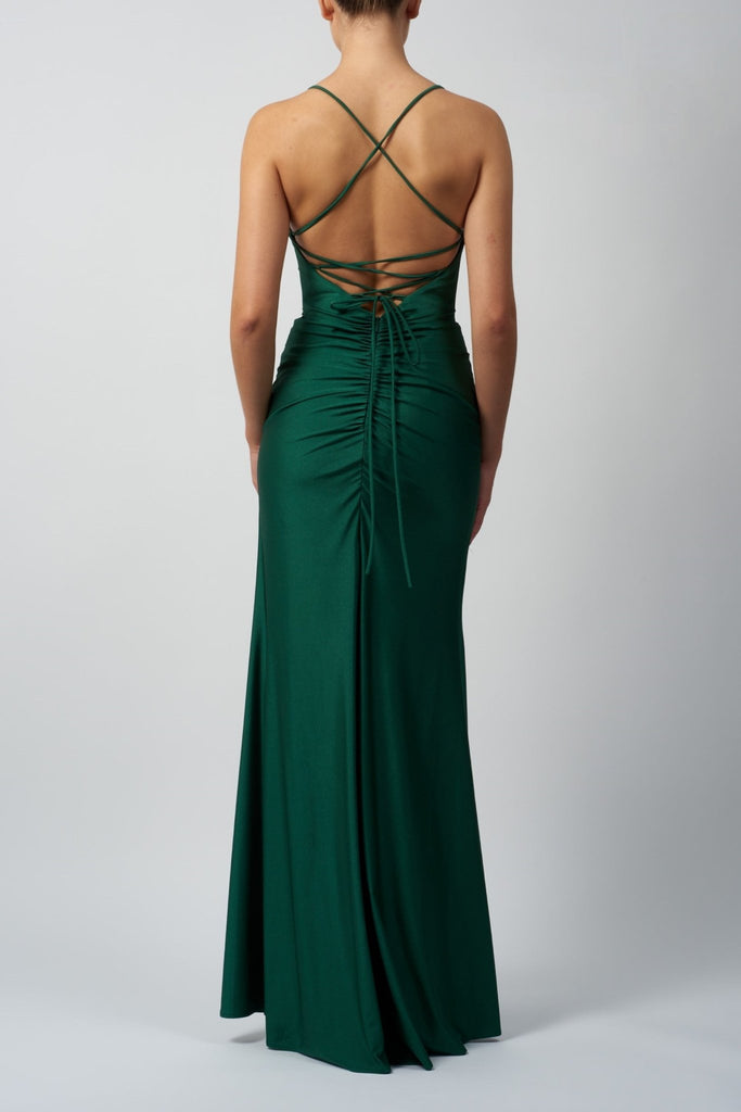 back view of lady wearing green rouched jersey dress with tie back