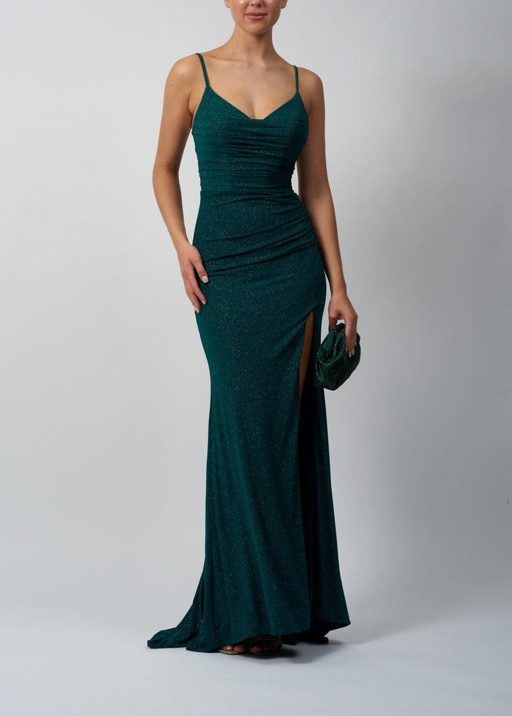 Image of a lady in a slim fitting green glitter long dress