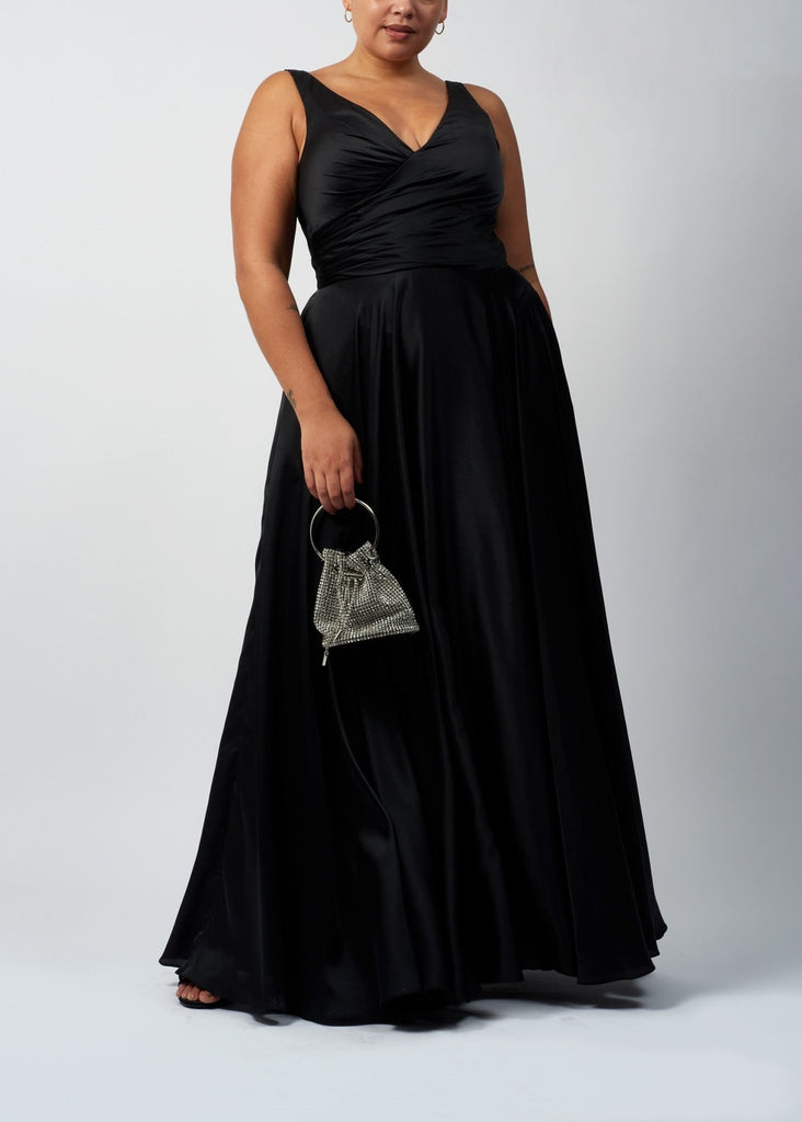 curvy lady wearing black wrap top satin ballgown