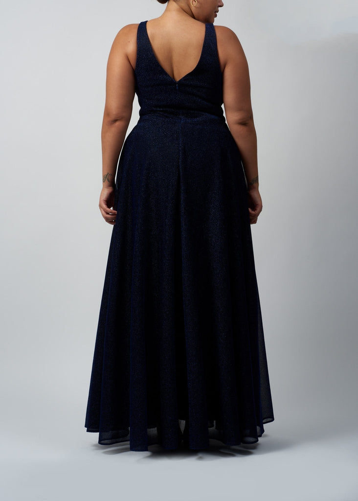 back view of curvy lady wearing glitter navy prom dress