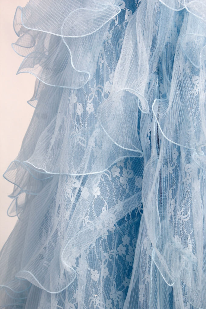 Close up of lace on sky blue dress