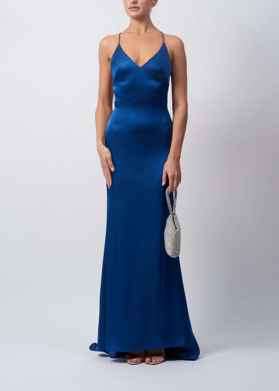 Young female standing in a Airforce Blue Satin Strap Dress by Mascara London