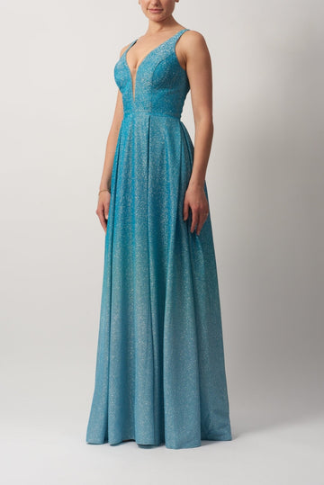 Young female standing in a Aqua Ombre flow glittery gown