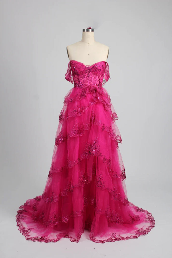 long pink ruffle dress on a mannequin