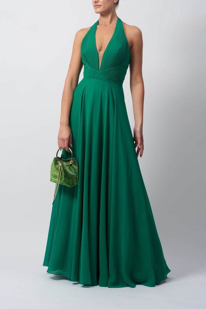 Young lady standing in a Emerald Pleated Halter Neck Dress