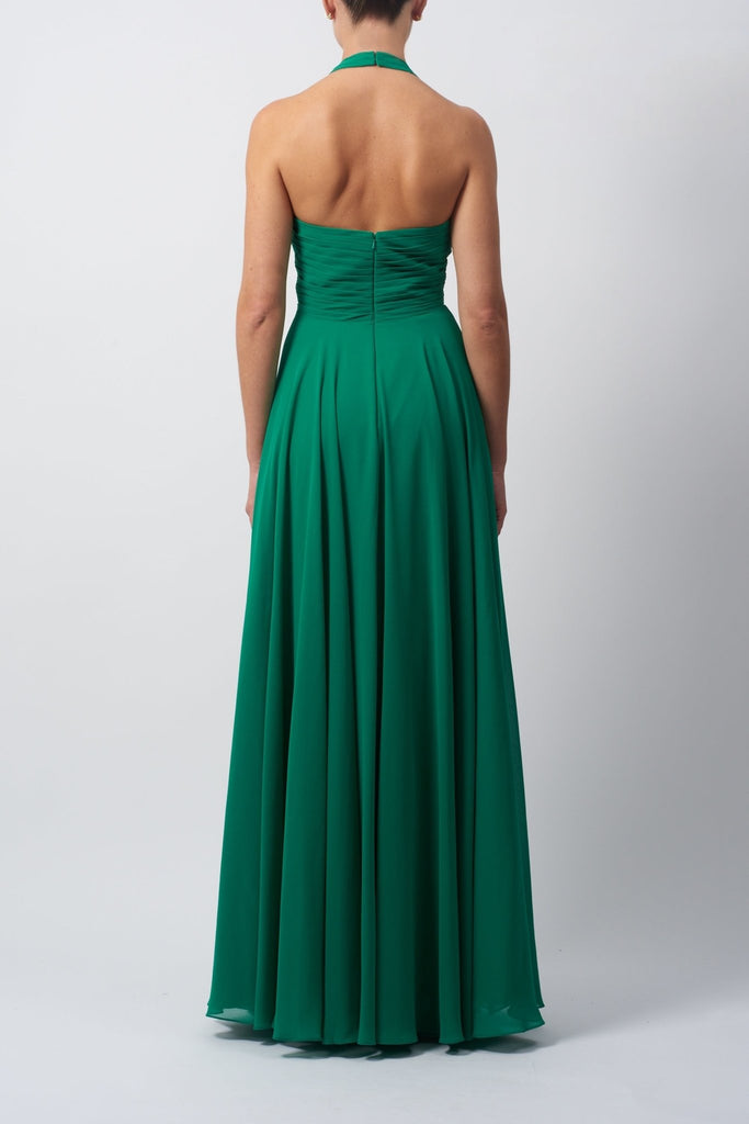 Young lady standing in a Emerald Pleated Halter Neck Dress back image