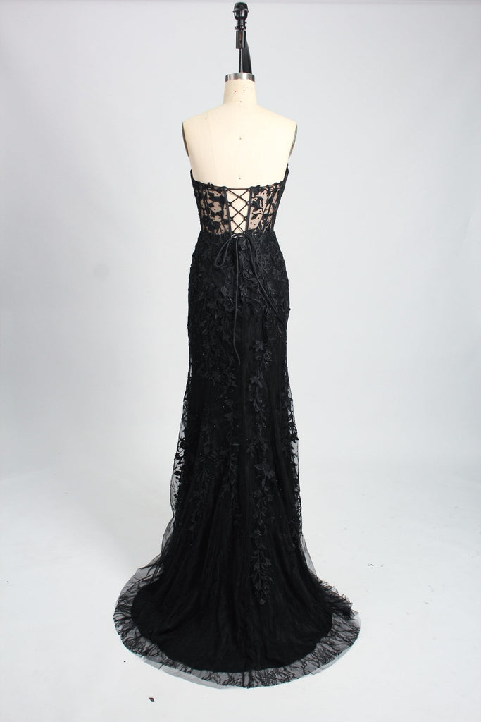 back view of a strapless lace black prom dress