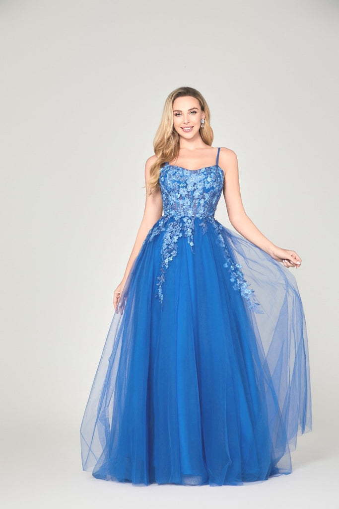 model wearing full royal blue ballgown
