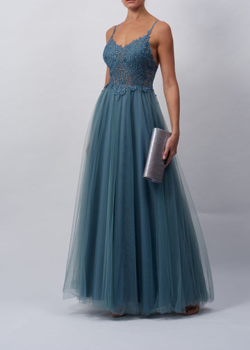 Model in a blue/grey prom dress