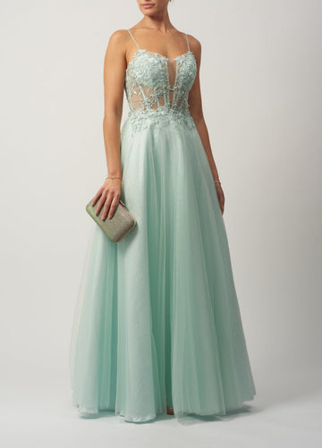 Young female standing in a Mint Tulle Glitter Ballgown