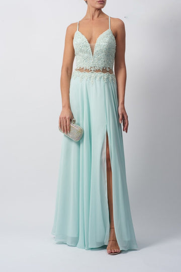 Young lady standing in a Mint Chiffon Prom Dress