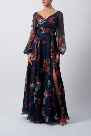 Young lady standing in a Navy Floral Long Sleeve Dress
